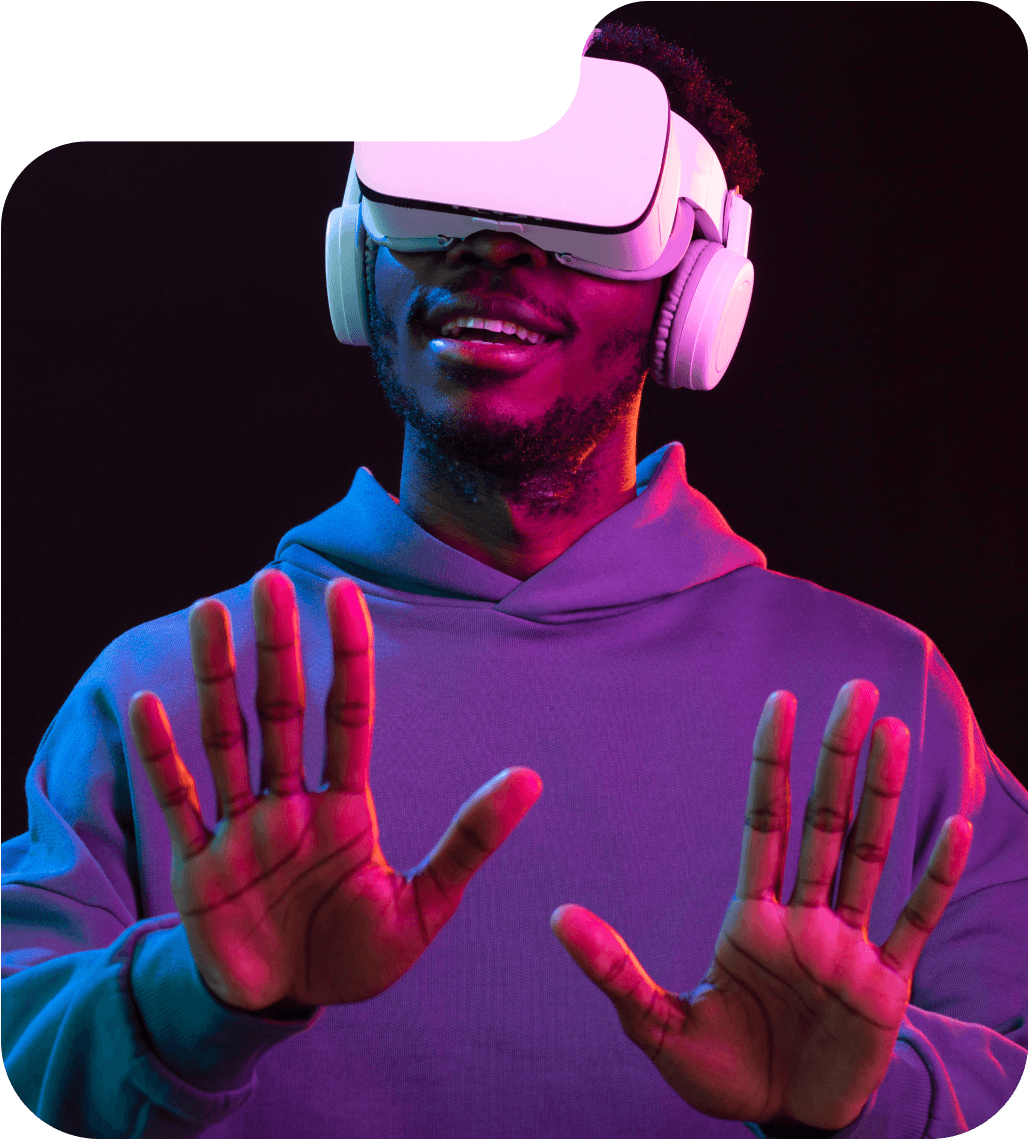 A man wearing a virtual reality tool and raising his palms